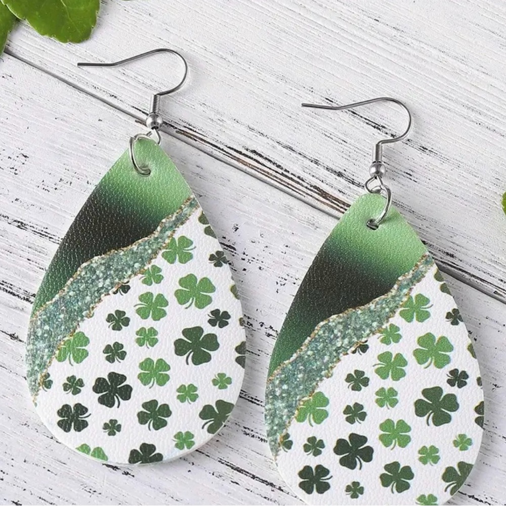 These green shamrock leaf earrings feature a charming white tear drop design.